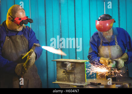 Welders working at work shop Stock Photo