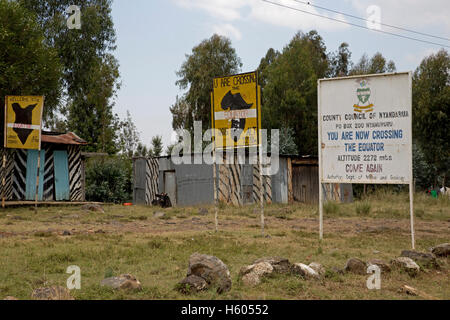 Equator signboards roadside near Nanuki Kenya Stock Photo