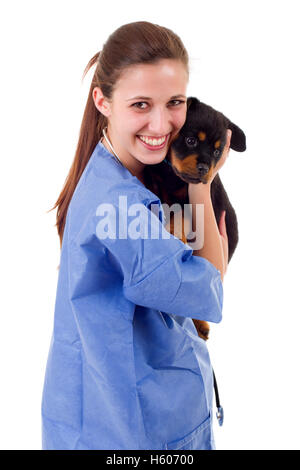 Brunette veterinary with a rottweiler puppy dog isolated on white background Stock Photo