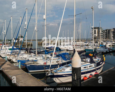 Yachts moored in redeveloped  Victoria Dock Caernarfon Gwynedd North Wales UK on the Menai Strait  in this ancient royal town Stock Photo