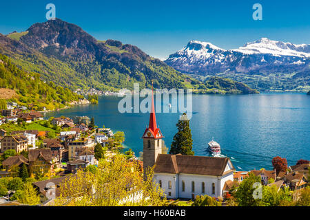 Famous boats on lake Lucerne in Weggis village with Swiss Alps in the background, Switzerland Stock Photo