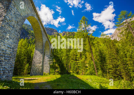 Famous landwasser Viaduct bridge on Albula pass in Swiss Alps Stock Photo