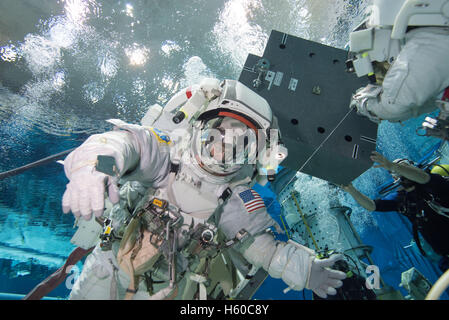 NASA International Space Station Expedition 50/51 Soyuz MS-03 crew member American astronaut Peggy Whitson floats underwater in a spacesuit for ISS EVA spacewalk maintenance training at the Sonny Carter Training Facility Neutral Buoyancy Laboratory January 12, 2016 in Houston, Texas. Stock Photo