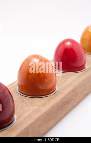 row of colorful easter eggs on white background Stock Photo