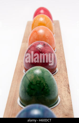 row of colorful easter eggs on white background Stock Photo