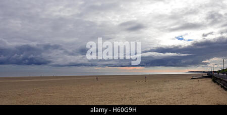 View across the sand and sea under a stormy sky at Gorleston, Great Yarmouth, Norfolk, UK Stock Photo