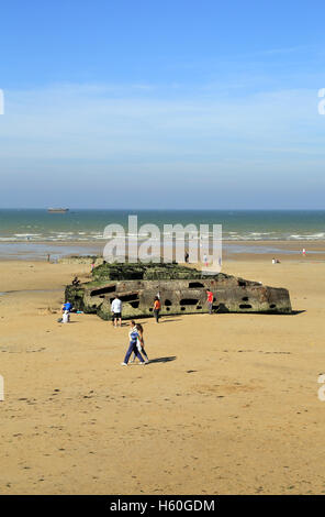 Remains of Mulberry harbour on the beach at Plage, Arromanches les Bains, Calvados, Basse Normandie, France Stock Photo
