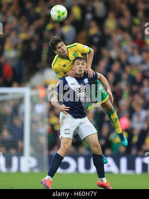 Norwich City's Russell Martin and Preston North End's Jordan Hugill (front) battle for the ball during the Sky Bet Championship match at Carrow Road, Norwich. Stock Photo