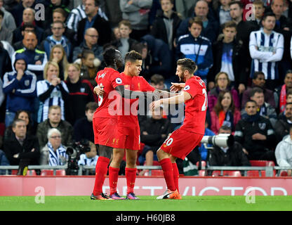 Liverpool's Philippe Coutinho (centre) celebrates scoring his side's second goal of the game during the Premier League match at Anfield, Liverpool. Stock Photo