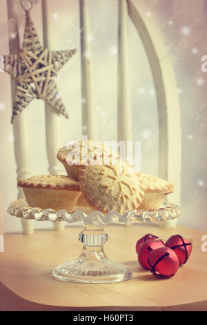 Mince pies on glass cake stand Stock Photo