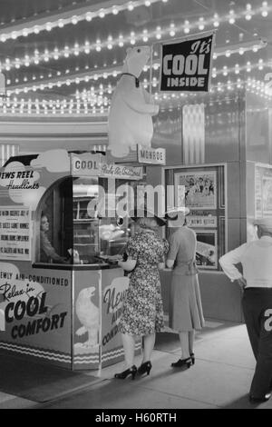 Two Women Buying Tickets at Movie Theater, Chicago, Illinois, USA,  John Vachon, U.S. Office of War Information, July 1940 Stock Photo