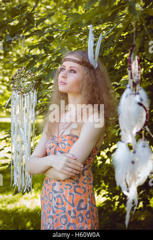 Portrait of Girl with Dreamctahcer Hanging Alongside Stock Photo