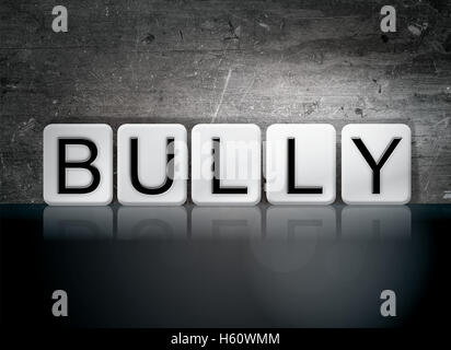 The word 'Bully' written in white tiles against a dark vintage grunge background. Stock Photo