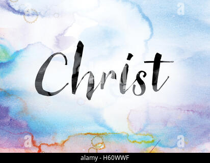 The word 'Christ' painted in black ink over a colorful watercolor washed background concept and theme. Stock Photo