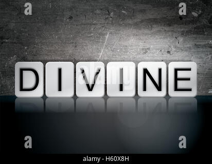 The word 'Divine' written in white tiles against a dark vintage grunge background. Stock Photo