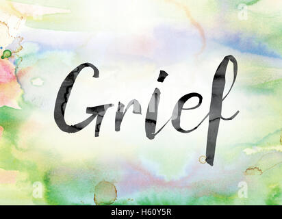 The word 'Grief' painted in black ink over a colorful watercolor washed background concept and theme. Stock Photo