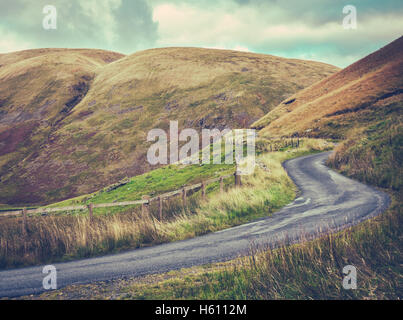 Winding   Road Up Through A Rugged Landscape Stock Photo