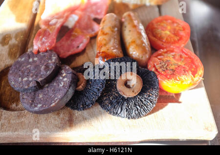 Full English Fried Breakfast on wooden platter Stock Photo