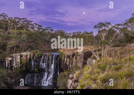 The waxing gibbous Moon over Upper Ebor Falls, on the Waterfall Way, between Armidale and Dorrigo, on the New England Tablelands Stock Photo