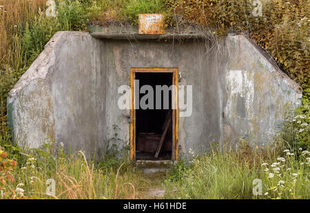 The view of the entrance to an abandoned Soviet military bunker Stock Photo