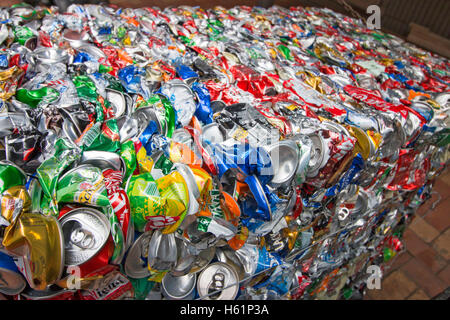 baled aluminium tin cans compressed ready for recycling. Stock Photo