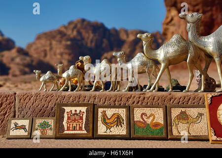 Camel souvenirs on sale at the Urn Tomb of the Royal Tombs in the rock city of Petra, Jordan Stock Photo