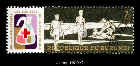 Postage stamp from Burundi depicting stretcher bearers with a wounded man. Stock Photo