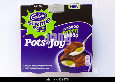 Cadbury screme egg Pots of Joy green goooo for Halloween isolated on white background Stock Photo
