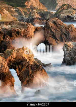 Arches and waves on Big Sur coast, California Stock Photo