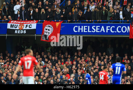 Manchester United fans look dejected in the stands after Chelsea take the lead during the Premier League match at Stamford Bridge, London. PRESS ASSOCIATION Photo. Picture date: Sunday October 23, 2016. See PA story SOCCER Chelsea. Photo credit should read: John Walton/PA Wire. RESTRICTIONS: No use with unauthorised audio, video, data, fixture lists, club/league logos or 'live' services. Online in-match use limited to 75 images, no video emulation. No use in betting, games or single club/league/player publications. Stock Photo