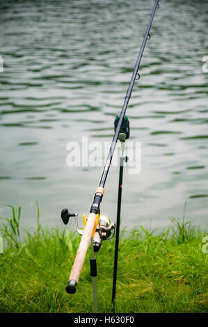 Fly-fisherman waiting with fishing pole on shoulder Stock Photo