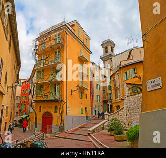The pleasant walk through the labyrinth of the old quarters with the unusual colorful houses Stock Photo