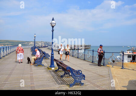 Visitors walking on Swanage Pier in Dorset, England. Stock Photo