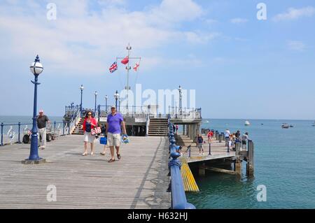 Couple walking on Swanage Pier in Dorset, England. Stock Photo