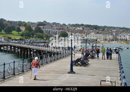 Visitors walking on Swanage Pier in Dorset, England. Stock Photo