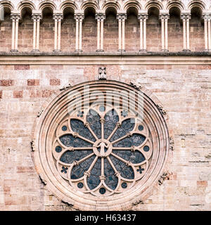 Trento Cathedral. Detail of the rosette said wheel of fortune for the represented iconographic motif. Stock Photo