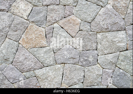 Textured gray stone packed in a tight angular pattern for a full frame abstract background Stock Photo