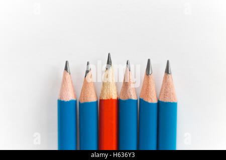 Simple sharp pencils isolated on white background, red among blue Stock Photo