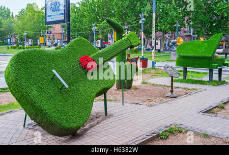 The park next to the Opera Theater decorated with installation of musical instruments - piano, saxophone and guitar Stock Photo