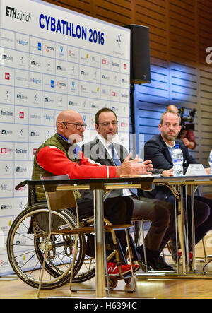Kloten, Switzerland - 8 October 2016: from left: Heinz Frei (Swiss paralympic wheelchair athlete), Professor Lino Guzella (President of the Swiss Federal Institute of Technology/ETH Zurich) and Robert Riener (Professor for Sensory-Motor Systems at the Department of Health Sciences and Technology of the Swiss Federal Institute of Technology/ETH Zurich) during the opening press conference of Cybathlon, the first championship for racing pilots with disabilities using bionic devices at the Swiss Arena in Kloten (Zurich), Switzerland. Stock Photo