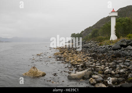 Ulvesund Lighthouse and strait near Måløy, western Norway on a foggy, wet day. Stock Photo