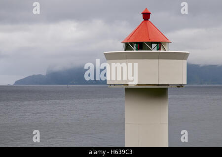 Ulvesund lighthouse ('fyr') and Silda island in the background, near Måløy, western Norway. Stock Photo