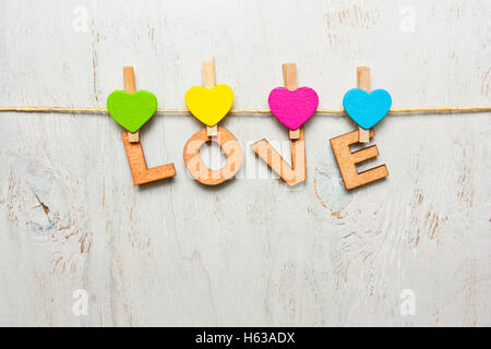 The word love made of wooden letters on a white background Stock Photo
