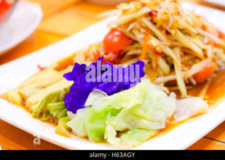 vegetable in dish with salad papaya on table Stock Photo