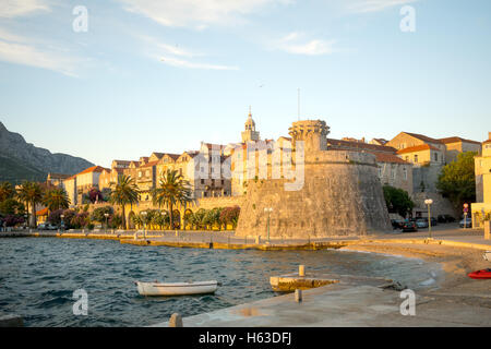 Sunset scene in the old town (west side), with the walls, houses, boats, in Korcula, Croatia Stock Photo