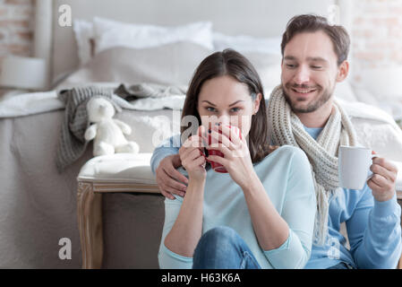 Good looking nice woman taking a sip of tea Stock Photo