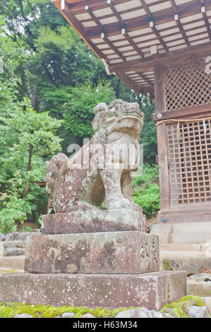 Komainu lion-dog guardian statue in Ujigami Shinto Shrine in Uji city near Kyoto Stock Photo