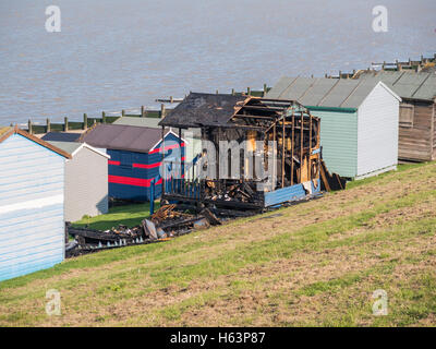 WHITSTABLE, UK - OCT 23 2016.  Two beach huts burnt out along Tankerton seafront, Whitstable. Local press report that arson is t Stock Photo