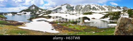 Panoramic view of Snowy Range Mountains and lake in Medicine Bow, Wyoming Stock Photo