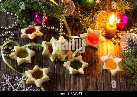 Stained cookies homemade star-shaped cookies with caramel. Gift for Christmas or New Year. Stock Photo